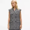 Chaleco de tweed con solapas de lentejuelas