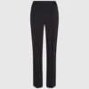 Pantalones con tachuelas Karl DNA