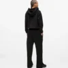 Pantalones de chándal con monograma y tachuelas