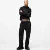 Pantalones de chándal con monograma y tachuelas
