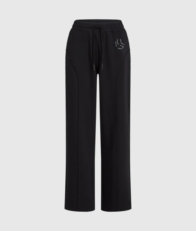 Pantalones de chándal con monograma y tachuelas