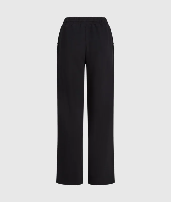 Pantalones de chándal con monograma y tachuelas