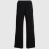 Pantalones de punto con detalles bouclé