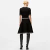 Vestido de punto con detalles bouclé