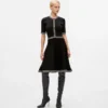 Vestido de punto con detalles bouclé